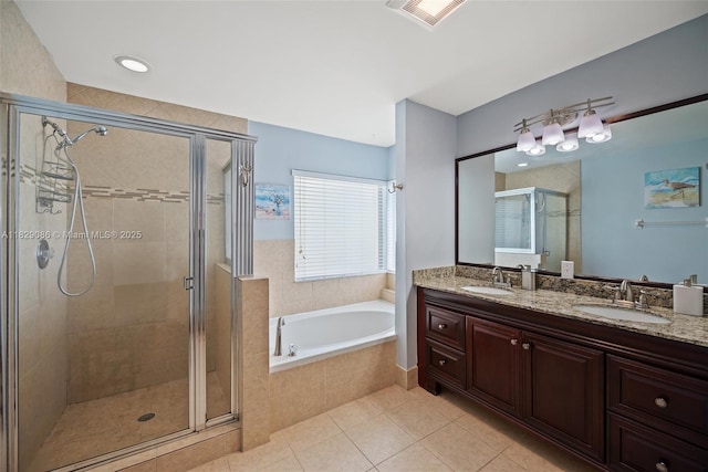 960 NW 185th Ave, Pembroke Pines, FL 33029 - bathroom featuring a bath, double vanity, a shower stall, and tile patterned floors
