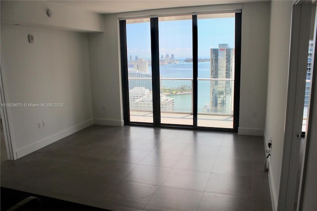 1010 Brickell Ave Unit 3403, Miami, FL 33131 - empty room featuring healthy amount of natural light, a water view, and a view of city