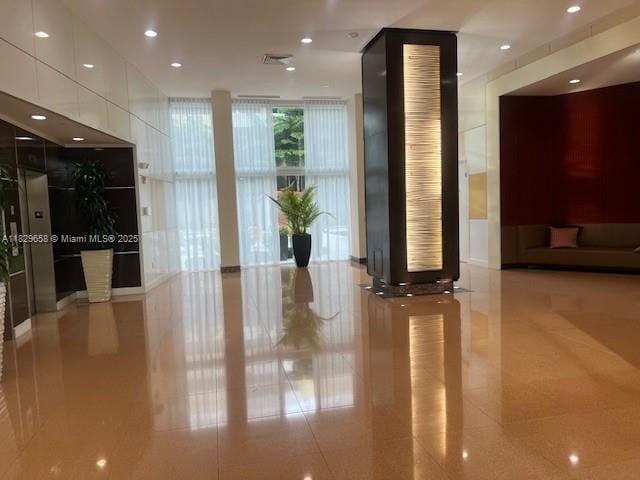 2775 NE 187th St Unit 202, Aventura, FL 33180 - lobby featuring expansive windows and recessed lighting