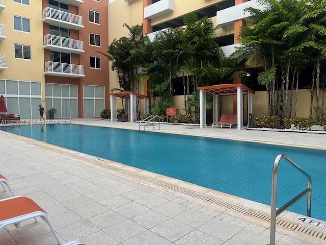 2775 NE 187th St Unit 202, Aventura, FL 33180 - community pool featuring a patio