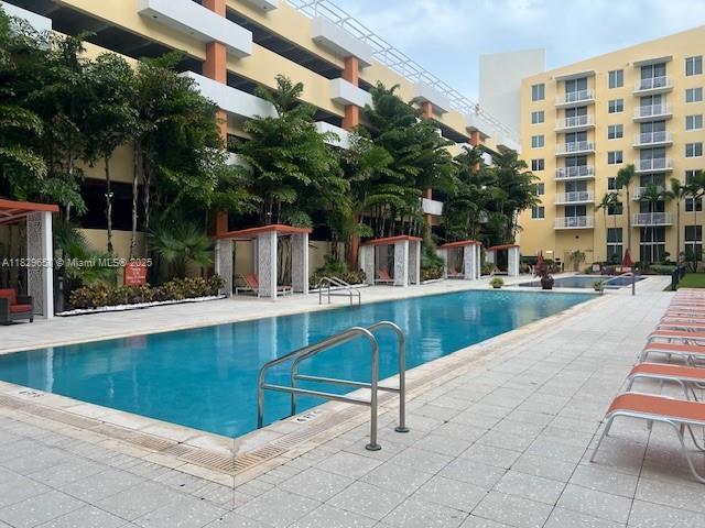 2775 NE 187th St Unit 202, Aventura, FL 33180 - community pool with a patio area