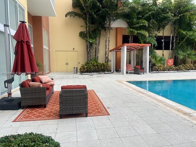 2775 NE 187th St Unit 202, Aventura, FL 33180 - view of swimming pool featuring a patio