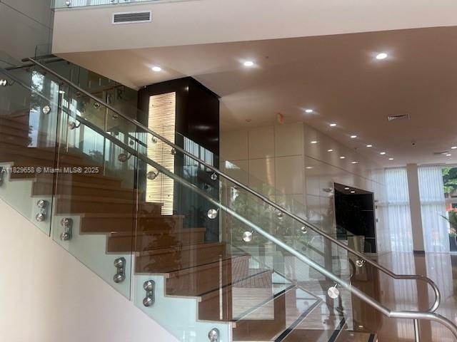 2775 NE 187th St Unit 202, Aventura, FL 33180 - stairs featuring recessed lighting