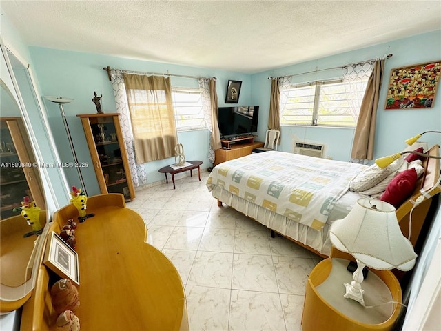 17001 NE 13th Ave Unit 202, Miami, FL 33162 - bedroom with a textured ceiling, marble finish flooring, and an AC wall unit