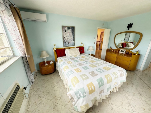 17001 NE 13th Ave Unit 202, Miami, FL 33162 - bedroom with a wall mounted air conditioner, marble look tile flooring, and heating unit