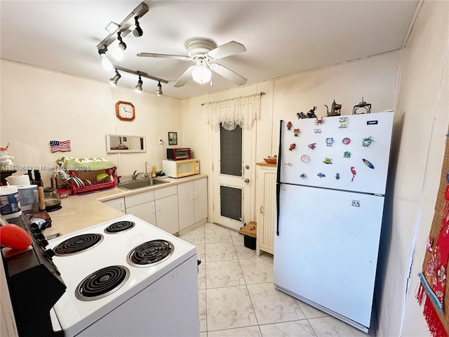 17001 NE 13th Ave Unit 202, Miami, FL 33162 - kitchen with white appliances, a ceiling fan, light countertops, light marble finish floors, and white cabinets