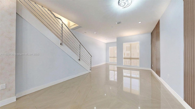 10255 NW 63rd Ter Unit 204, Doral, FL 33178 - unfurnished living room with stairway and baseboards