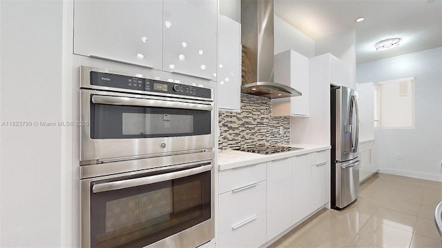 10255 NW 63rd Ter Unit 204, Doral, FL 33178 - kitchen with stainless steel appliances, modern cabinets, wall chimney exhaust hood, white cabinets, and tasteful backsplash