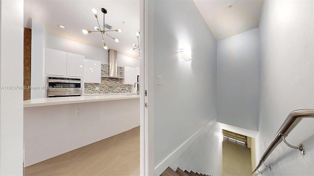10255 NW 63rd Ter Unit 204, Doral, FL 33178 - staircase featuring a chandelier and lofted ceiling