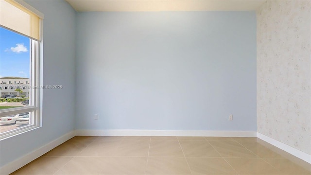 10255 NW 63rd Ter Unit 204, Doral, FL 33178 - unfurnished room featuring plenty of natural light, light tile patterned floors, and wallpapered walls