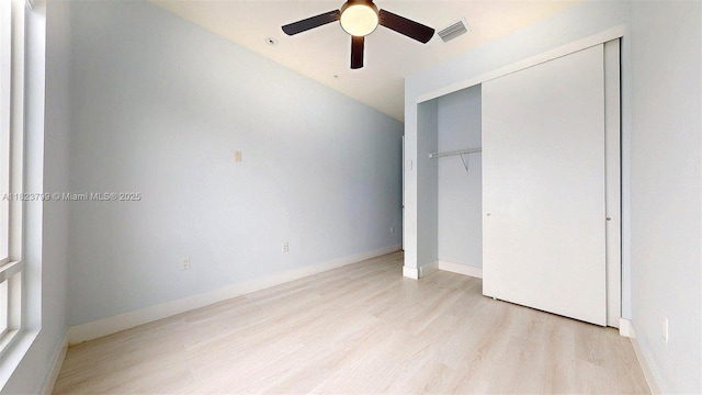 10255 NW 63rd Ter Unit 204, Doral, FL 33178 - unfurnished bedroom featuring light wood-style flooring, a closet, and a ceiling fan