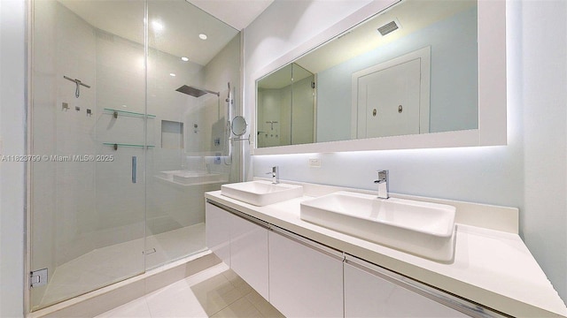 10255 NW 63rd Ter Unit 204, Doral, FL 33178 - bathroom featuring a stall shower, double vanity, and tile patterned floors