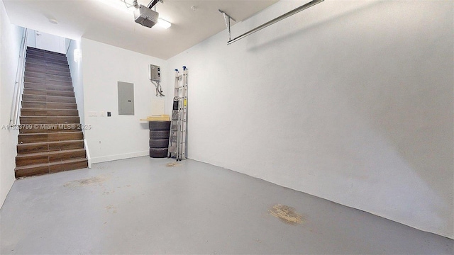 10255 NW 63rd Ter Unit 204, Doral, FL 33178 - garage featuring electric panel and a garage door opener