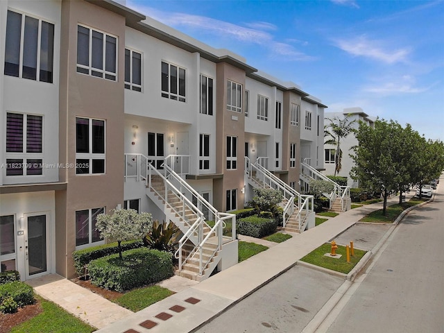 10255 NW 63rd Ter Unit 204, Doral, FL 33178 - view of building exterior with stairway and a residential view