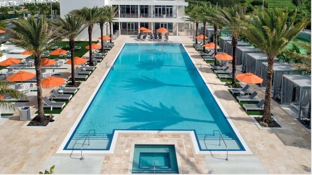 10255 NW 63rd Ter Unit 204, Doral, FL 33178 - community pool with a patio area