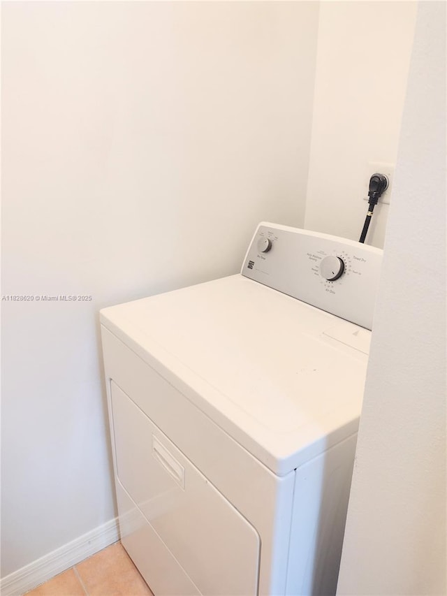 654 SW 106th Ave Unit 1502, Pembroke Pines, FL 33025 - washroom featuring washer / dryer and light tile patterned floors