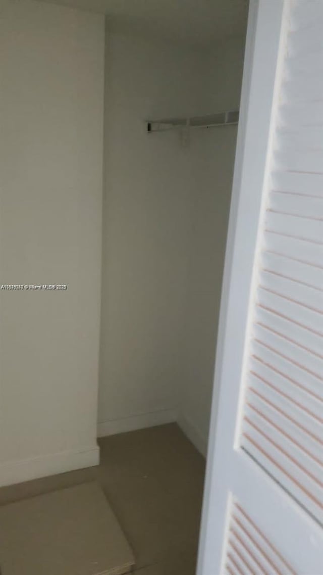 19380 Collins Ave Unit 808, Sunny Isles Beach, FL 33160 - walk in closet with tile patterned floors
