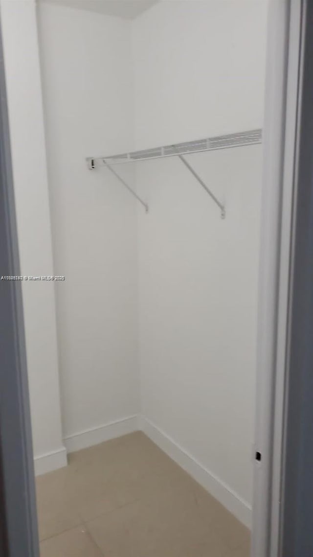 19380 Collins Ave Unit 808, Sunny Isles Beach, FL 33160 - walk in closet with light tile patterned floors