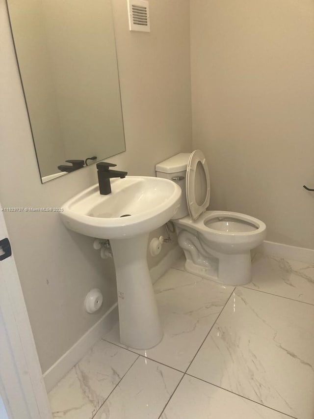 25767 SW 144th Ave, Homestead, FL 33032 - bathroom featuring marble finish flooring and baseboards