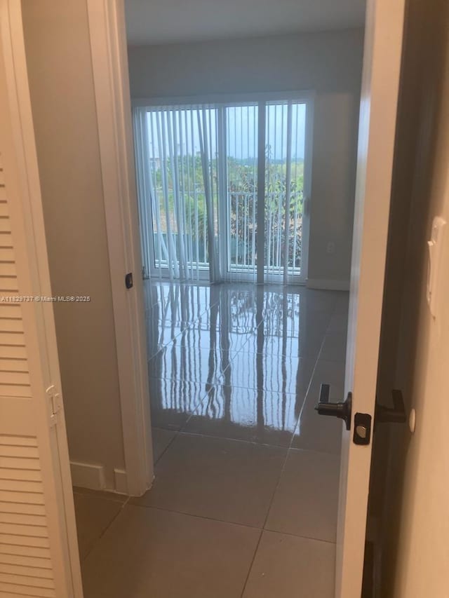 25767 SW 144th Ave, Homestead, FL 33032 - hall with tile patterned flooring and baseboards