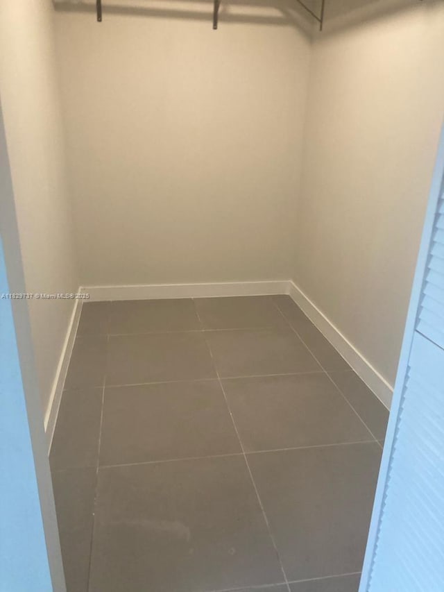 25767 SW 144th Ave, Homestead, FL 33032 - spacious closet with dark tile patterned floors