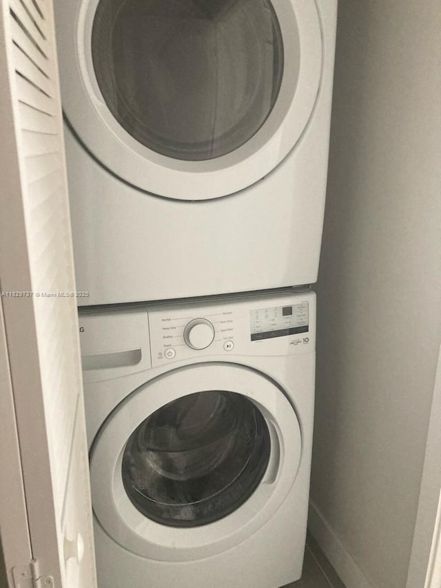25767 SW 144th Ave, Homestead, FL 33032 - laundry room featuring stacked washer / drying machine