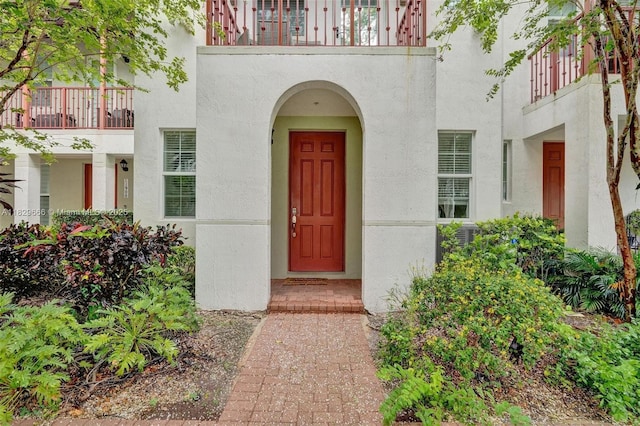 11898 SW 25th Ct Unit 103, Miramar, FL 33025 - view of exterior entry featuring stucco siding and a balcony