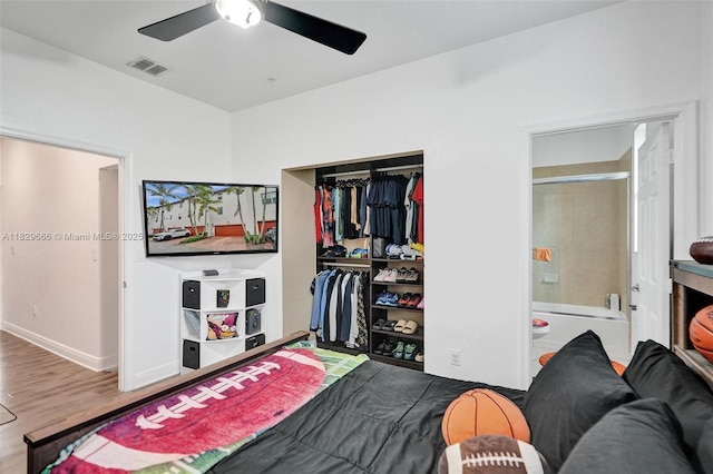 11898 SW 25th Ct Unit 103, Miramar, FL 33025 - bedroom with a closet, wood finished floors, a ceiling fan, and ensuite bathroom