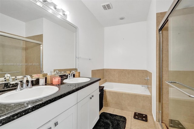 11898 SW 25th Ct Unit 103, Miramar, FL 33025 - full bathroom with a shower stall, double vanity, a garden tub, and tile patterned floors