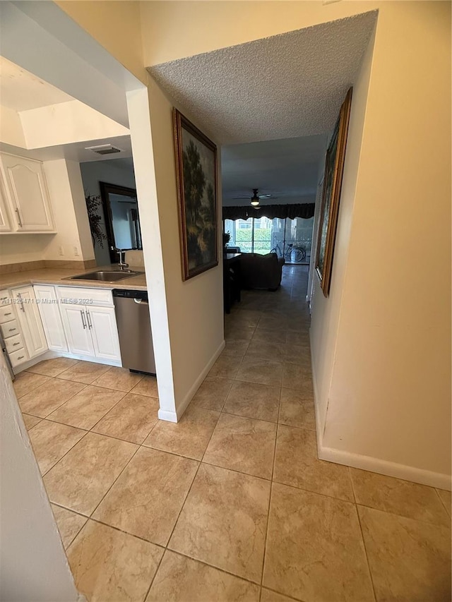 2371 SW 15th St Unit 101, Deerfield Beach, FL 33442 - hallway featuring light tile patterned floors and a textured ceiling