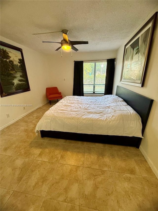 2371 SW 15th St Unit 101, Deerfield Beach, FL 33442 - bedroom featuring a textured ceiling, tile patterned flooring, and ceiling fan