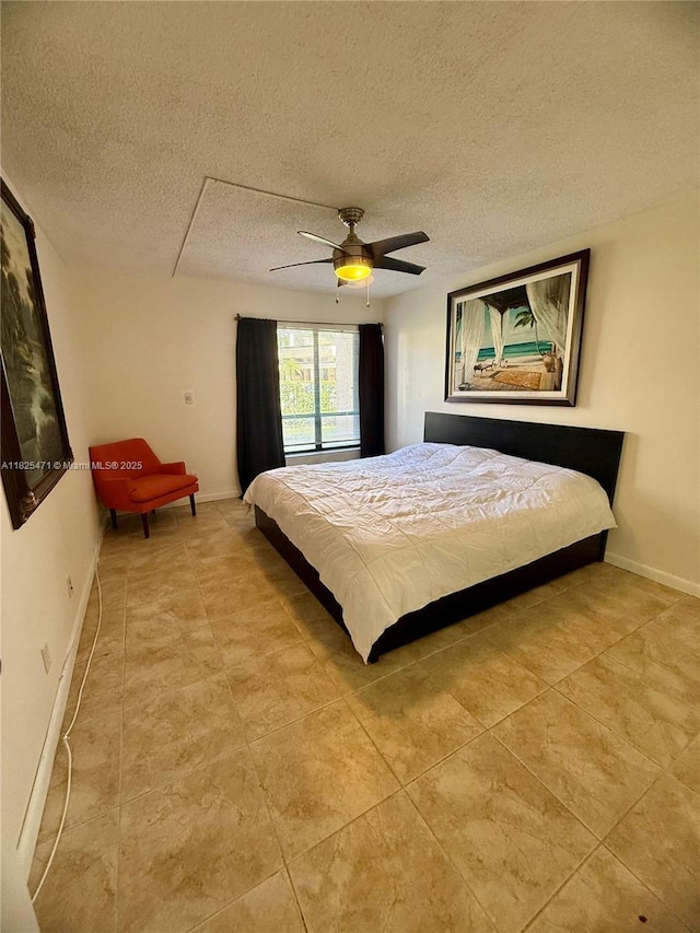2371 SW 15th St Unit 101, Deerfield Beach, FL 33442 - bedroom featuring a textured ceiling, ceiling fan, and light tile patterned floors