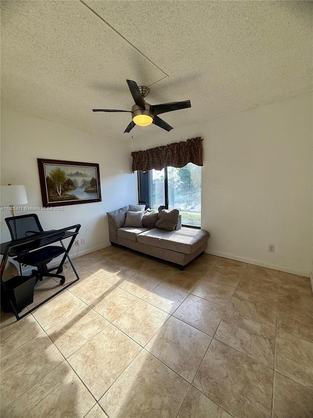 2371 SW 15th St Unit 101, Deerfield Beach, FL 33442 - living room with light tile patterned flooring, a ceiling fan, and a textured ceiling