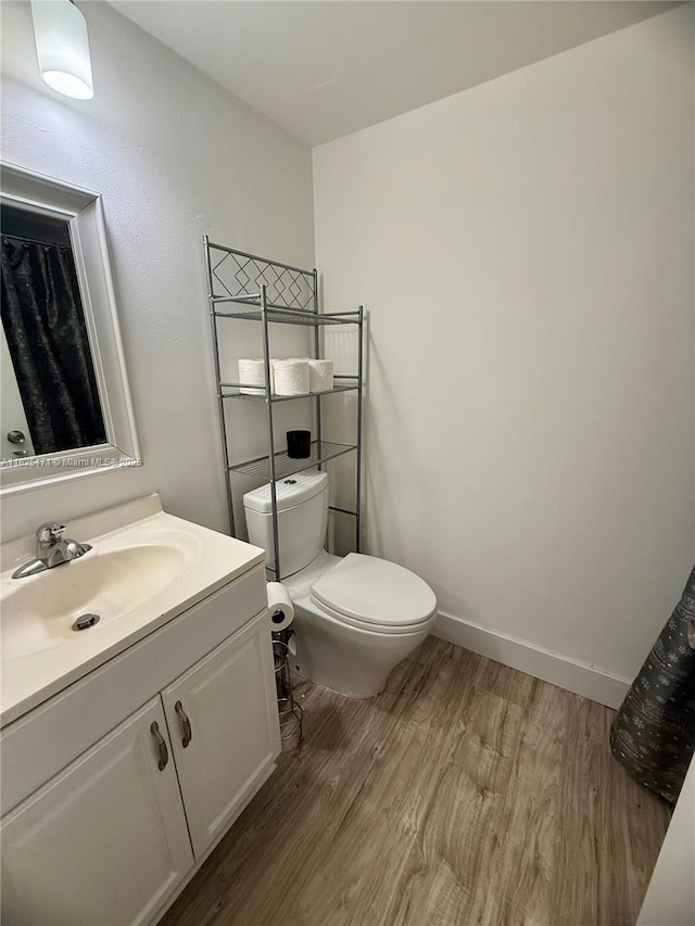 2371 SW 15th St Unit 101, Deerfield Beach, FL 33442 - bathroom with wood finished floors and vanity