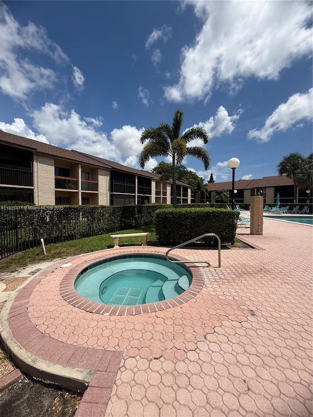 2371 SW 15th St Unit 101, Deerfield Beach, FL 33442 - view of swimming pool featuring a community hot tub and a swimming pool