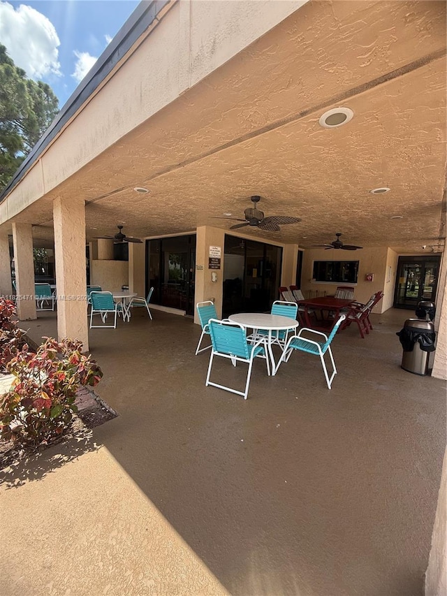 2371 SW 15th St Unit 101, Deerfield Beach, FL 33442 - view of patio featuring outdoor dining area and ceiling fan