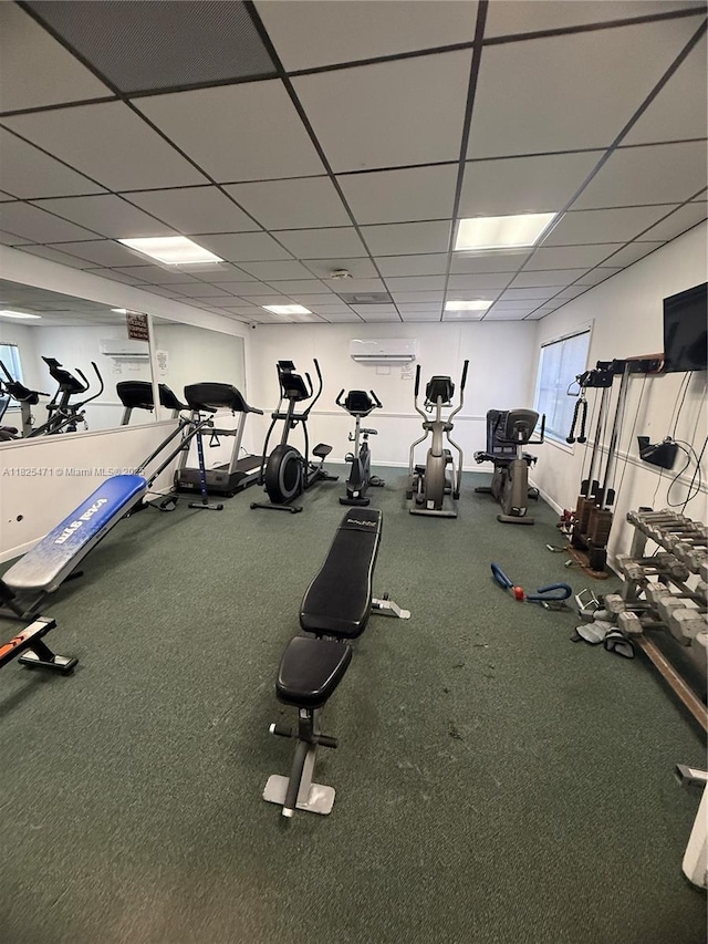 2371 SW 15th St Unit 101, Deerfield Beach, FL 33442 - gym featuring a paneled ceiling and an AC wall unit