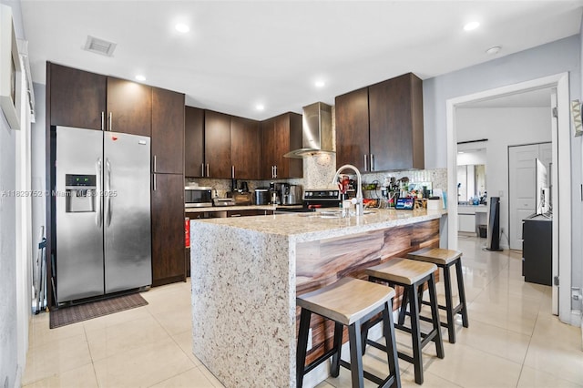 17625 NW 62nd Ct, Hialeah, FL 33015 - kitchen with appliances with stainless steel finishes, wall chimney exhaust hood, dark brown cabinets, backsplash, and recessed lighting