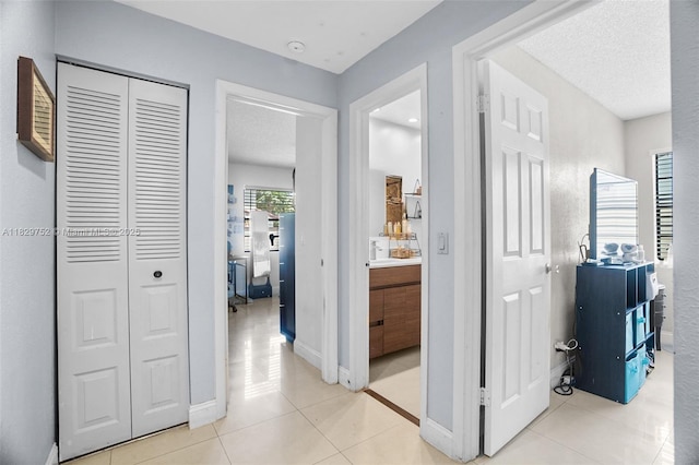 17625 NW 62nd Ct, Hialeah, FL 33015 - hallway featuring light tile patterned floors and baseboards