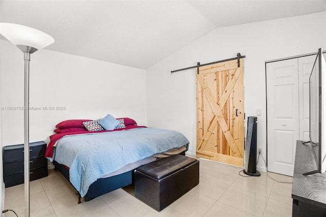 17625 NW 62nd Ct, Hialeah, FL 33015 - bedroom with vaulted ceiling, a barn door, and light tile patterned flooring