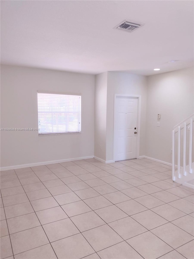 8380 SW 25th Ct Unit 104, Miramar, FL 33025 - spare room featuring light tile patterned flooring and baseboards