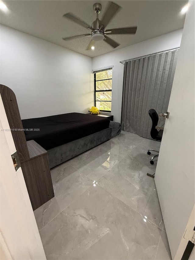 7440 SW 153rd Ct Unit 107-4, Miami, FL 33193 - unfurnished bedroom with marble tiled flooring and a ceiling fan