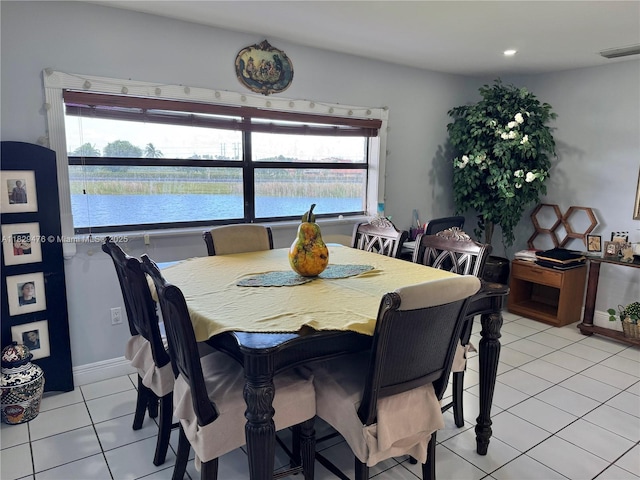13261 SW 17th Ln, Miami, FL 33175 - dining space featuring light tile patterned flooring, a water view, and recessed lighting