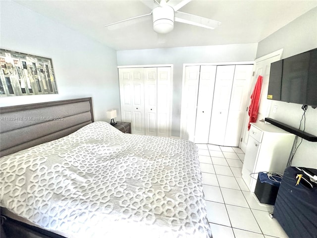 13261 SW 17th Ln, Miami, FL 33175 - bedroom featuring two closets, light tile patterned flooring, and a ceiling fan