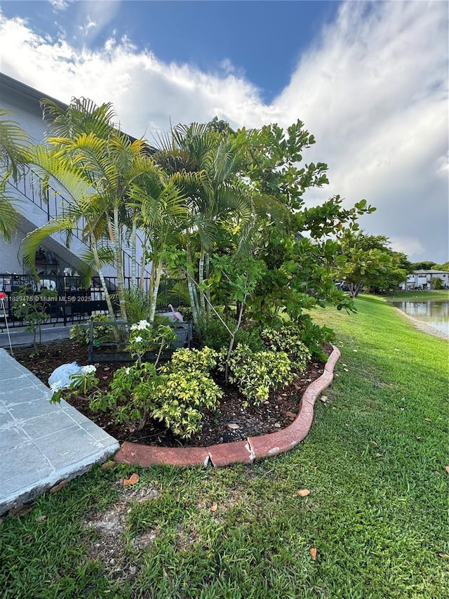 13261 SW 17th Ln, Miami, FL 33175 - view of green lawn featuring a water view
