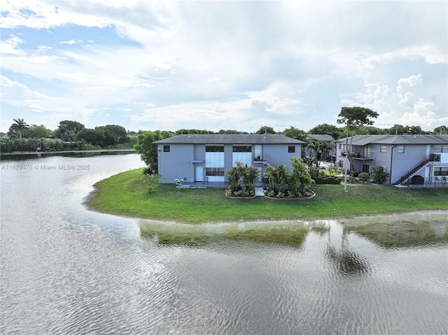 13261 SW 17th Ln, Miami, FL 33175 - view of front of property with a water view, a front lawn, and a residential view