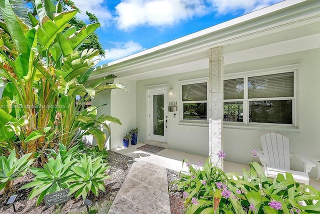 15730 SW 87th Ct, Palmetto Bay, FL 33157 - property entrance with stucco siding and a porch