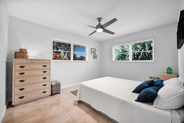 15730 SW 87th Ct, Palmetto Bay, FL 33157 - bedroom with light tile patterned flooring and a ceiling fan