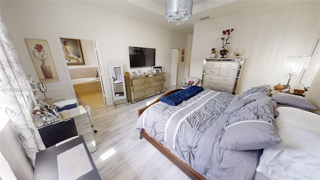 4231 SW 165th Ct, Miami, FL 33185 - bedroom featuring light wood finished floors and a chandelier