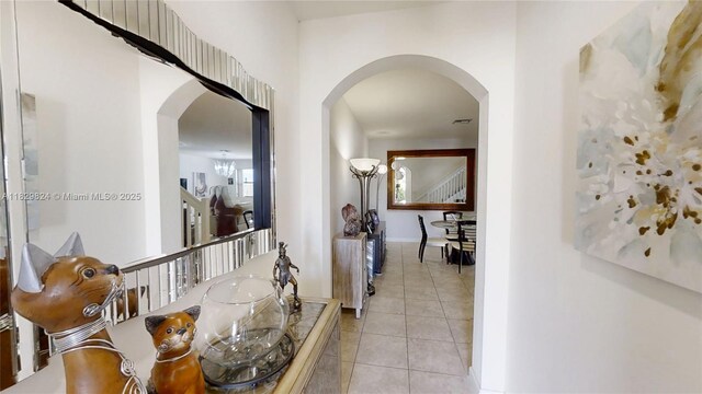 4231 SW 165th Ct, Miami, FL 33185 - hallway with arched walkways and light tile patterned floors